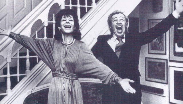 two people in black and white, singing with their arms outstretched. Betty Comden and Adolph Green in Richard Hanson's Fall 2019 lecture